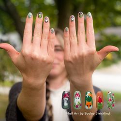Riversong Spa & Salon - Whimsical forest-themed gel nail art featuring mushrooms, ghosts, a fox, and a frog, created with OPI polish by Baylee Stricklind