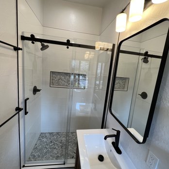Tech Line Construction - bathroom with a sink and shower - General Contractors Near Me Tech Line Construction - bathroom with a sink and shower - General Contractors Near Me