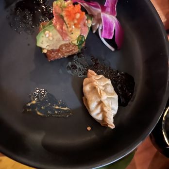 Saku - a plate of food on a table - Cocktail Bars Near Me - Hoboken, New Jersey