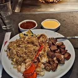 Benihana - The Deluxe Treat was delicious. Filet Mignon and Lobster with veggies (zucchini and onions) and fried rice.