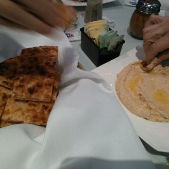 Atlas Mediterranean Kitchen - Hummus (whom moose) & toasted, thick Iranian/Persian Sangak flatbread. Shaker of Somagh, dusky, sour, fruitiness to awaken meats, savories. - Mediterranean Near Me - Simi Valley, California Atlas Mediterranean Kitchen - Hummus (whom moose) & toasted, thick Iranian/Persian Sangak flatbread. Shaker of Somagh, dusky, sour, fruitiness to awaken meats, savories. - Mediterranean Near Me - Simi Valley, California