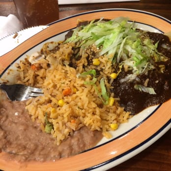 Tulcingo Restaurant - Rice and beans with mole on top of Chicken tacos. - Mexican Near Me - Jackson Heights, New York