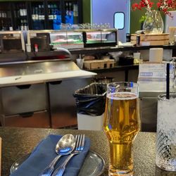 Super Sap's - At the bar with an Asahi beer and a glass of water.