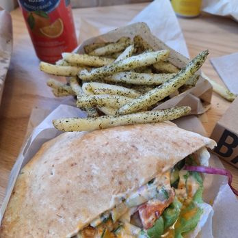 Falafel - Their famous Falafel sandwich and zatar fries. A San Pellegeino drink - Falafel Near Me - Arlington, Virginia