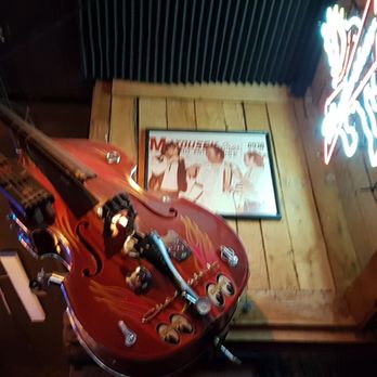 Nashville Crossroads - Double bass on the wall at Nashville Crossroads - Bars Near Me - Nashville, Tennessee