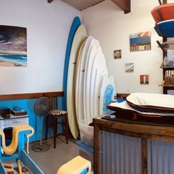 Delray Surf Designs - PJ Bergman holding up one of his amazing surfboards.