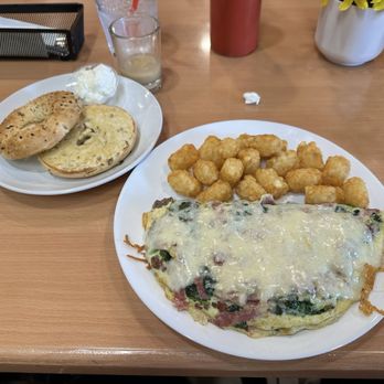 Strange Brews Coffee & Bites - Build Your Own Omelette with turkey bacon, ground beef, spinach, and swiss cheese, side everything bagel - Breakfast & Brunch Near Me - Buena Park, California