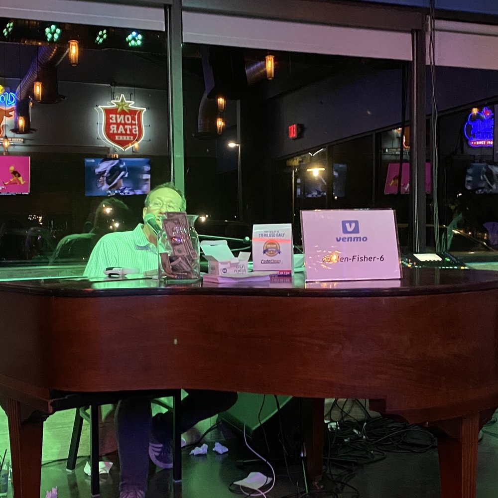 a man sitting at a piano a man sitting at a piano