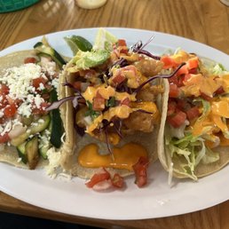 Veggie, beer battered fish, and Firecracker Shrimp Taco Veggie, beer battered fish, and Firecracker Shrimp Taco