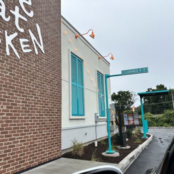 Popeyes - a brick building with graffiti on it - Chicken Wings Near Me - Harmarville, Pennsylvania