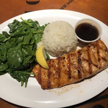 Bubba Gump Shrimp - Makers mark glazed salmon with sautéed spinach and rice - Seafood Near Me - Orlando, Florida