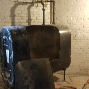 Green Energy AC Heating & Plumbing Repair - The old oil tank being cut up. - Heating & Air Conditioning/HVAC Near Me - Canton, Massachusetts Green Energy AC Heating & Plumbing Repair - The old oil tank being cut up. - Heating & Air Conditioning/HVAC Near Me - Canton, Massachusetts