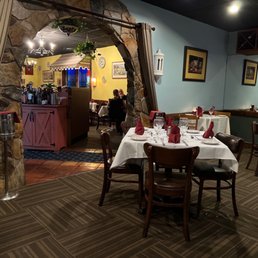 a dining room with tables and chairs