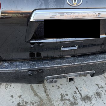 Palmer Custom Painting - overspray on back bumper of car - trunk didn't have much since most of it was covered - Painters Near Me