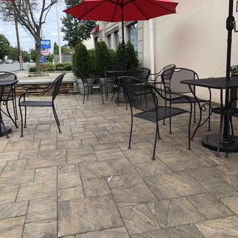 Hot Bagels Abroad - a patio with tables and umbrellas - Bagels Near Me - Bloomfield, New Jersey