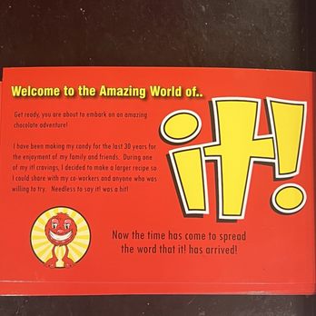 it! Candy - Karen's story - A red card with yellow and black text promoting the word "I!" at a candy shop, featuring a cartoon smiling candy character. - Candy Stores Near Me - Bristol, Connecticut