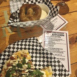 Free-Range Kitchen - Tasty chicken BBQ flatbread+ that delicious pretzel with queso. The trailer was slingin' tasty treats at Iron Monk Brewery. Jan 2019
