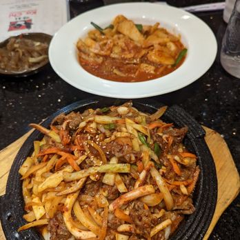 Ka Chi - Spicy stir fried udon with squid + beef at the front and dukbokki in the back - Korean Near Me - Toronto, Ontario Ka Chi - Spicy stir fried udon with squid + beef at the front and dukbokki in the back - Korean Near Me - Toronto, Ontario