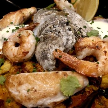 Mariposa - Gullah Paella
Crisped Carolina gold rice pilaf, andouille & chorizo, gulf shrimp, fresh daily catch, oysters, soffrito, saffron - Tapas/Small Plates Near Me - Charlotte, North Carolina Mariposa - Gullah Paella
Crisped Carolina gold rice pilaf, andouille & chorizo, gulf shrimp, fresh daily catch, oysters, soffrito, saffron - Tapas/Small Plates Near Me - Charlotte, North Carolina