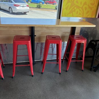 Dave's Hot Chicken - Indoor seating at a high table - Chicken Shop Near Me - Greenville, South Carolina
