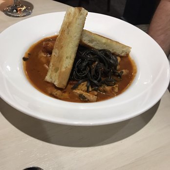 Table 28 - Seafood with squid ink pasta - New American Near Me - Little Rock, Arkansas