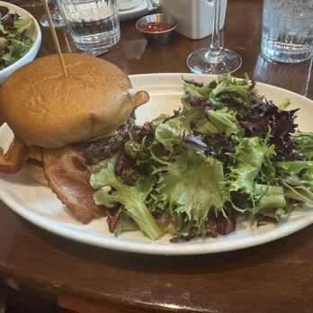 Chef Geoff's West End - CG bacon cheddar burger with gluten-free bun and balsamic greens (including skewer as marker for gluten allergy). - New American Near Me - Washington, DC, District of Columbia