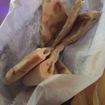 TIQA - Pita bread served with the Tehina. - Mediterranean Near Me - Portland, Maine TIQA - Pita bread served with the Tehina. - Mediterranean Near Me - Portland, Maine