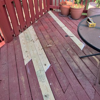 Phoenix Emerging Enterprises - a deck with a table and chairs - Handyman Near Me - Atlanta, Georgia Phoenix Emerging Enterprises - a deck with a table and chairs - Handyman Near Me - Atlanta, Georgia