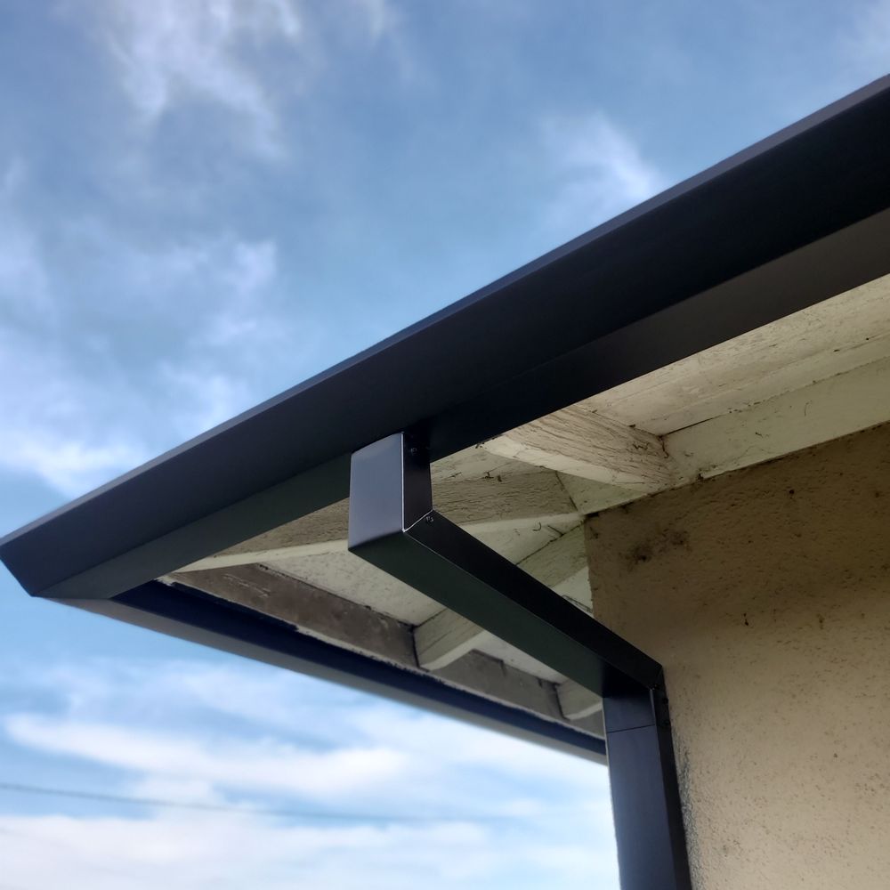 Anaheim Rain Gutter - Black angle faced with custom drops. - Gutter Services Near Me