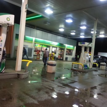 bp - a man standing in front of a gas pump - Gas Stations Near Me - Wilson, North Carolina