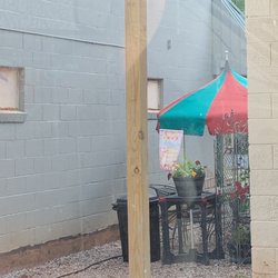 The Roost Ice Cream Shop - Seating in between buildings