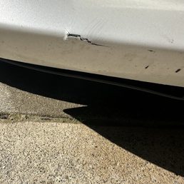 Car damaged when driving by where they were haphazardly trimming a tree.