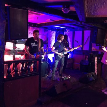 The Rose & Crown - a band performing in a dimly lit room - Music Venues Near Me - Toronto, Ontario The Rose & Crown - a band performing in a dimly lit room - Music Venues Near Me - Toronto, Ontario