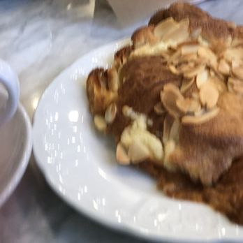 Le Paris Brest Cafe - Almond Croissant. Not a good picture.  It was good.  Maybe a little more toasted - Patisserie/Cake Shop Near Me - Henderson, Nevada