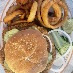 Pork tenderloin.with onion rings.