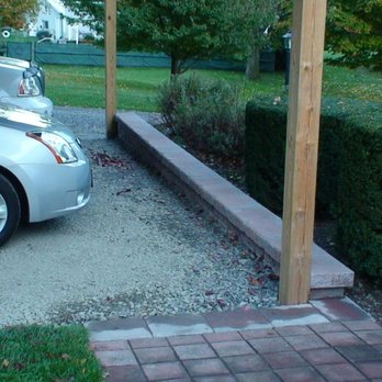 Grassmasters Landscaping - a car parked under a pergol roof - Landscaping Near Me - Freeville, New York Grassmasters Landscaping - a car parked under a pergol roof - Landscaping Near Me - Freeville, New York