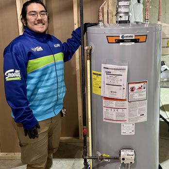 Smooth Plumbing - Smiling technician who just completed a water heater replacement in Woodbridge VA - Plumbing Near Me Smooth Plumbing - Smiling technician who just completed a water heater replacement in Woodbridge VA - Plumbing Near Me