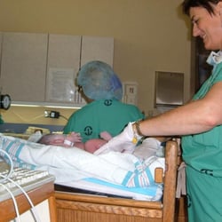 Comprehensive Healthcare For Women - Dr. Dillon and nurse tend to Payton