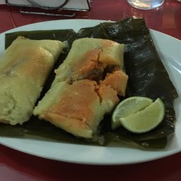 Pork tamales - one piece of pork each; this was how they were presented...I did not unwrap them nor touch the dish prior to taking picture Pork tamales - one piece of pork each; this was how they were presented...I did not unwrap them nor touch the dish prior to taking picture
