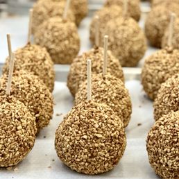 a tray of apples covered in oatmeal