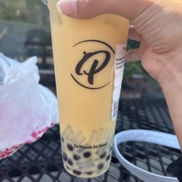 Mango milk tea with boba and lychee jelly