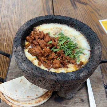Vidorra - Flaming Fundido- Trompo pastor and pico de gallo, comes with 4 flower tortillas. Delicious! - Mexican Near Me - Dallas, Texas