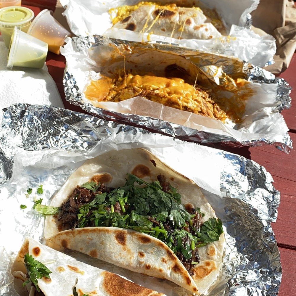 Con Madre Kitchen - Breakfast Tacos - barbacoa with cilantro- chorizo egg and cheese - potatoe egg and cheese with flour tortillas - Mexican Near Me - Austin, Texas Con Madre Kitchen - Breakfast Tacos - barbacoa with cilantro- chorizo egg and cheese - potatoe egg and cheese with flour tortillas - Mexican Near Me - Austin, Texas