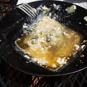 Kafé Neo Edmonds - Gross amount of left over dressing from small Greek salad. - Greek Near Me - Edmonds, Washington