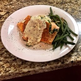 Stuffed Salmon with crabmeat with a side of garlic potatoes and sautéed green beans.