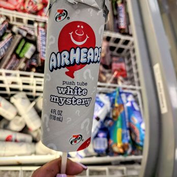 7-Eleven - a person holding a candy bar - Convenience Stores Near Me - South El Monte, California 7-Eleven - a person holding a candy bar - Convenience Stores Near Me - South El Monte, California