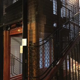 Lovely working antique elevator. Love the ambience here. Lovely working antique elevator. Love the ambience here.