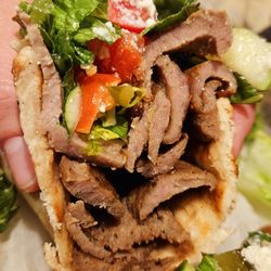 Pita King - Stacks of gyro in their sandwich