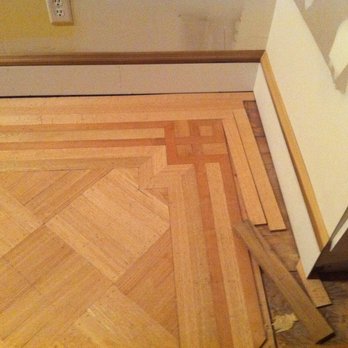 Benjamin Floors - a hardwood floor being laid in a room - Flooring Near Me Benjamin Floors - a hardwood floor being laid in a room - Flooring Near Me