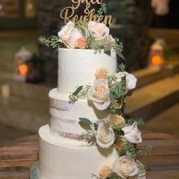 a wedding cake with flowers a wedding cake with flowers